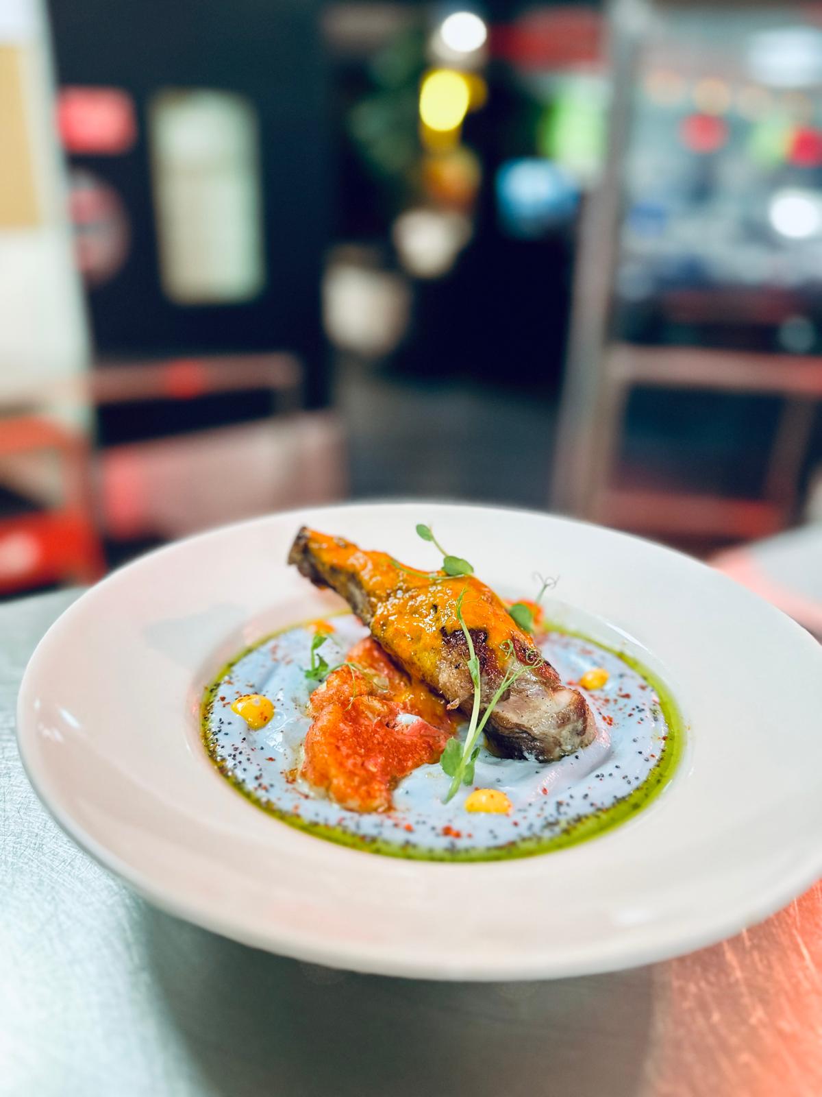 Confit lamb shank with pepper coulis